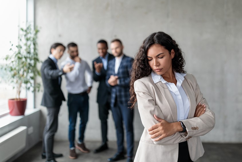 A woman experiencing workplace discrimination, consulting with a solicitor for legal guidance.